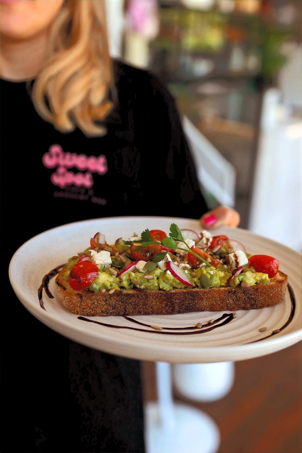 Sweet Spot smashed avocado with fresh tomatoes and feta